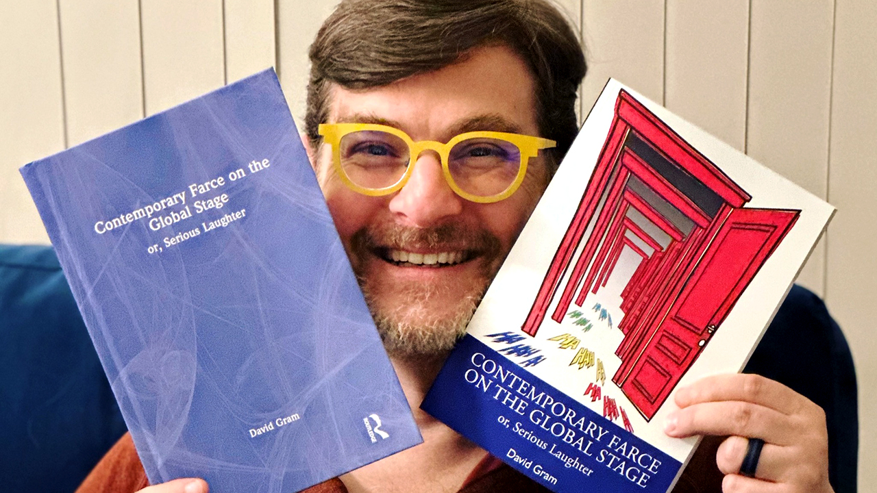 David Gram with his book, "Contemporary Farce on the Global Stage: Or, Serious Laughter"