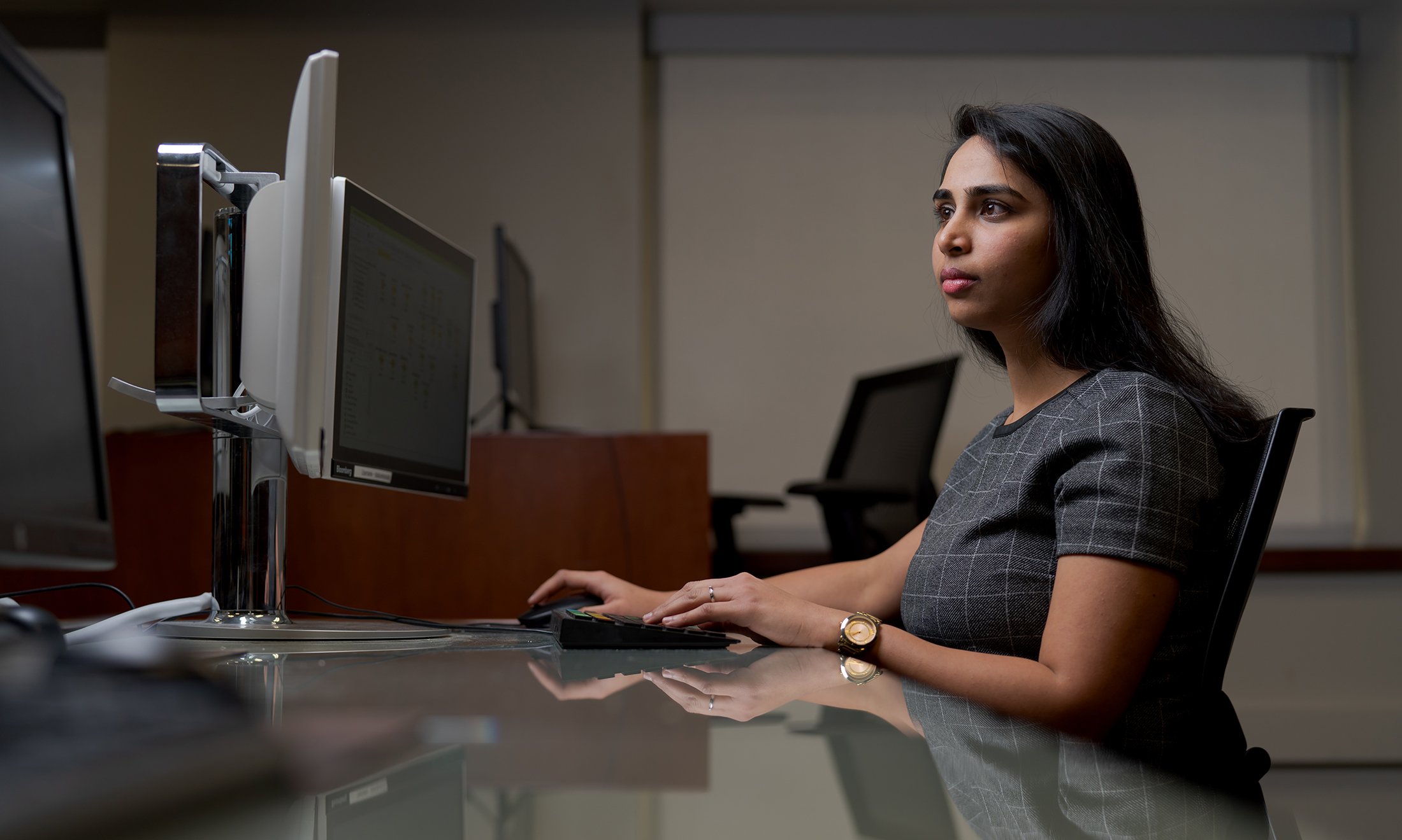 A woman sitting at a computer.