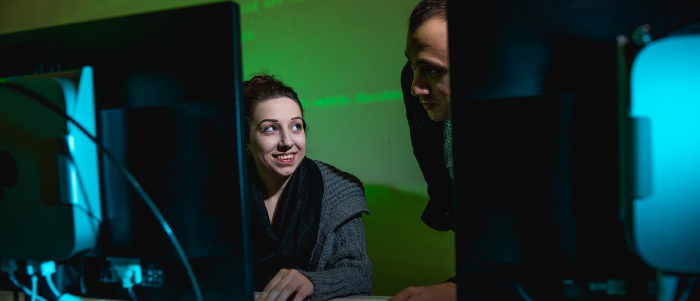 2 individuals at computer screen