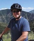 Eric LaRock, on a bike, wearing helmet.