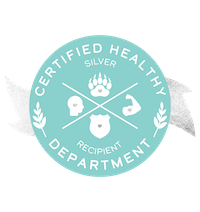 A digital badge that says Certified Healthy Department Silver Recipient with a silver ribbon and symbols