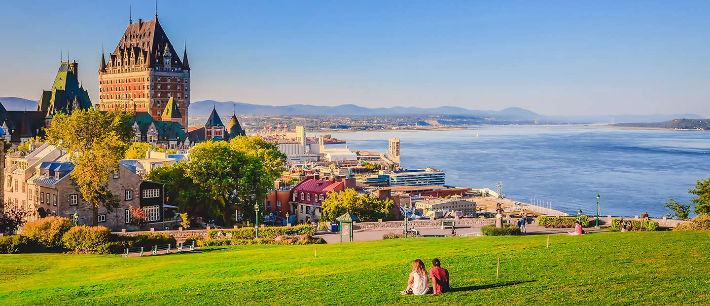 A photo overlooking the city of Quebec and a coastline.