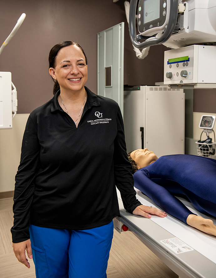 Sara Rivard in an x-ray lab smiling confidently