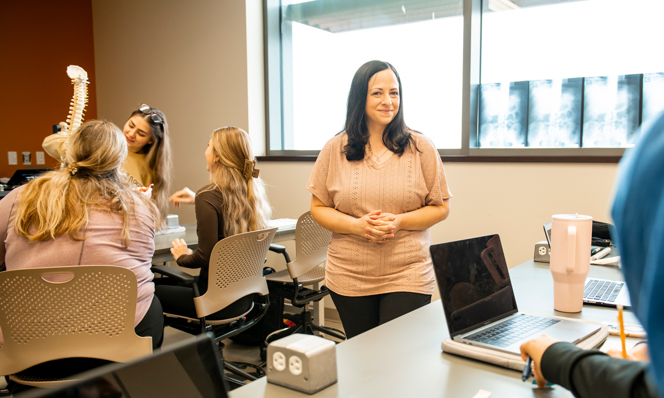 Sara Rivard in a radiology classroom with students working