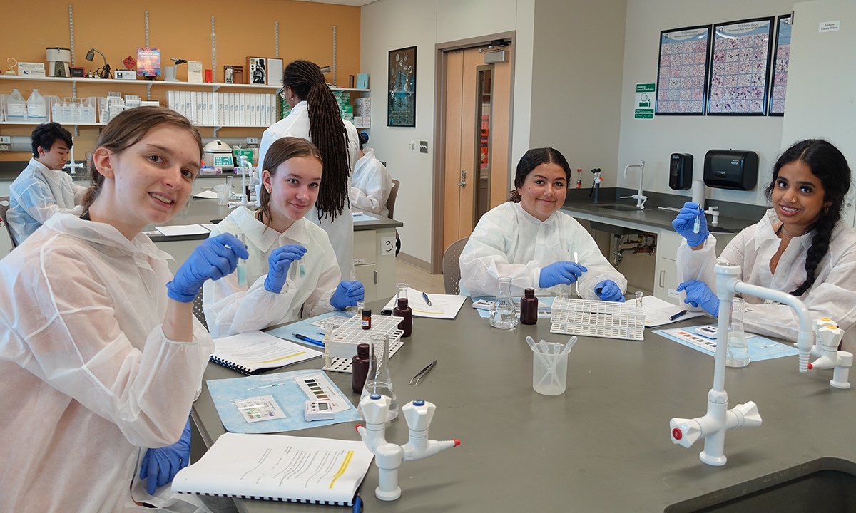 A group of students participate in activities in the lab