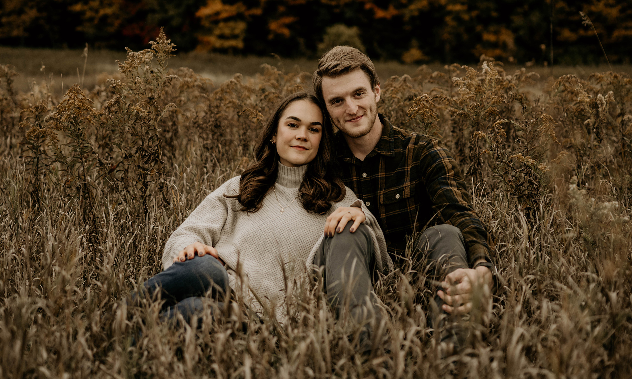 An image of Jessica and Andrew in a field
