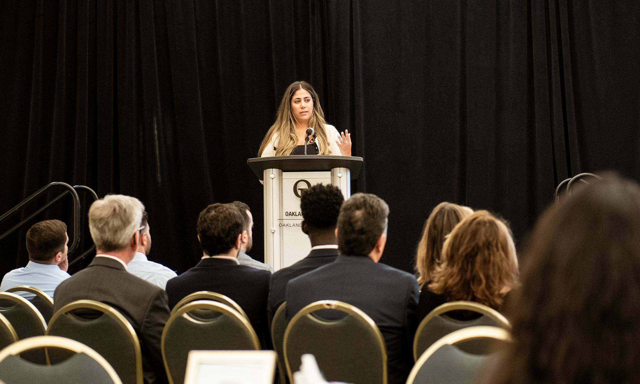 An image of Dr. Thomas speaking during the memorial