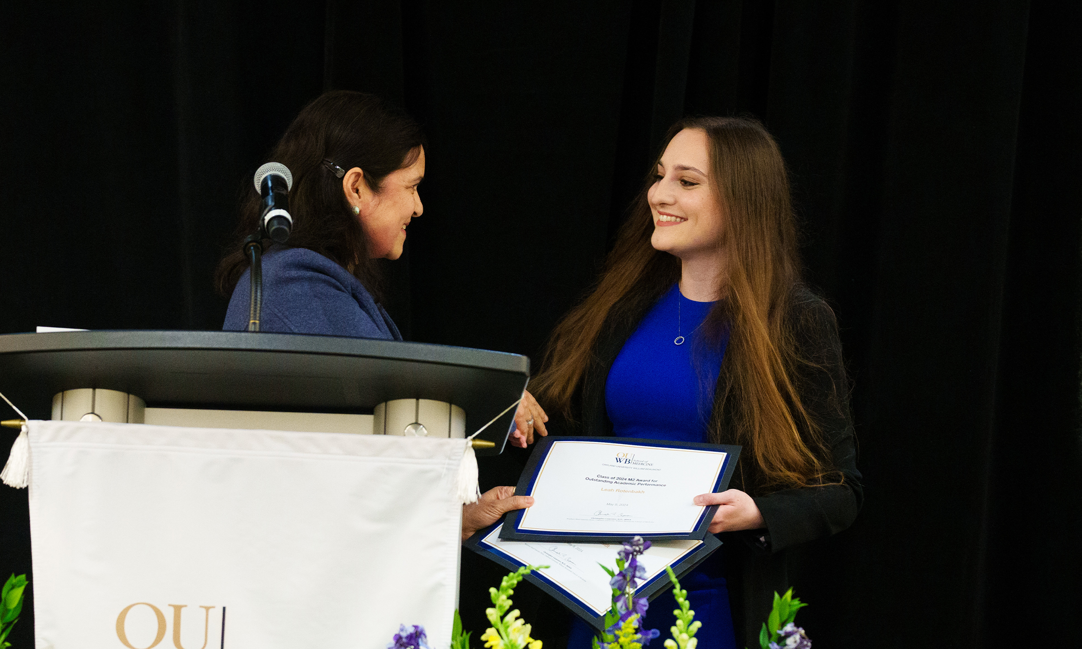 An image of a student receiving an award at the event