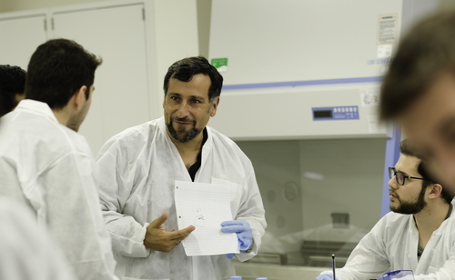 An image of Claudio Cortes in OUWB's microbiology lab