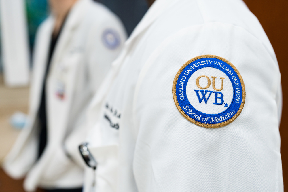 An image of a white coat with the OUWB patch