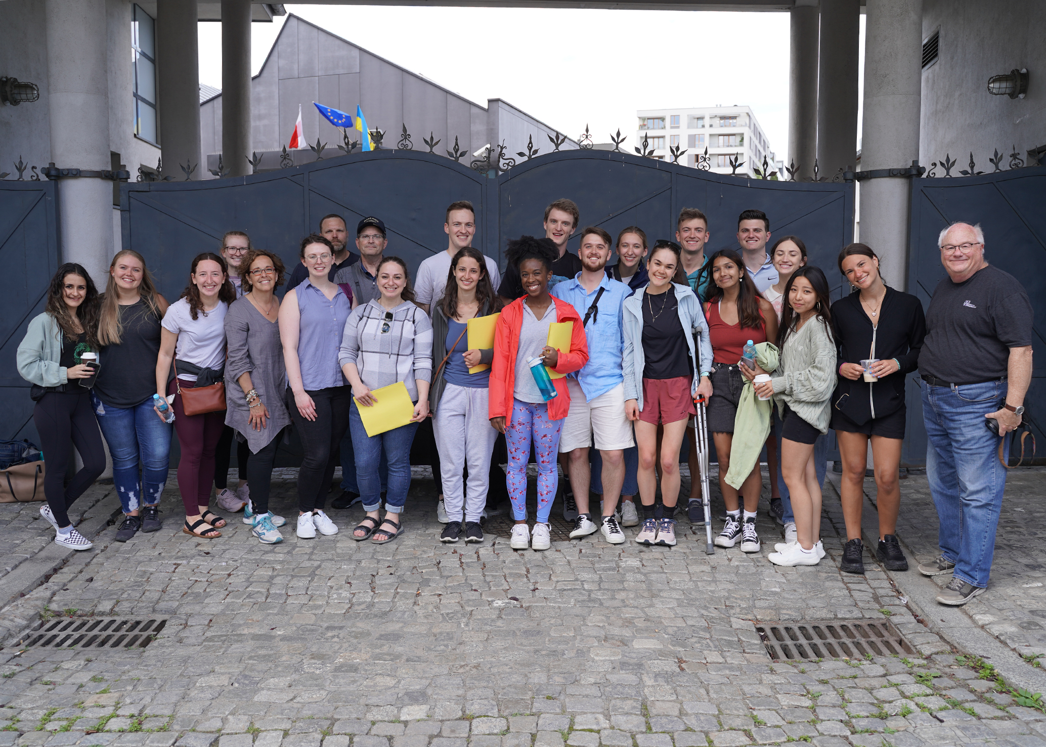 A group of students in front of the gates to Schindlers Factory, Krakow, Poland
