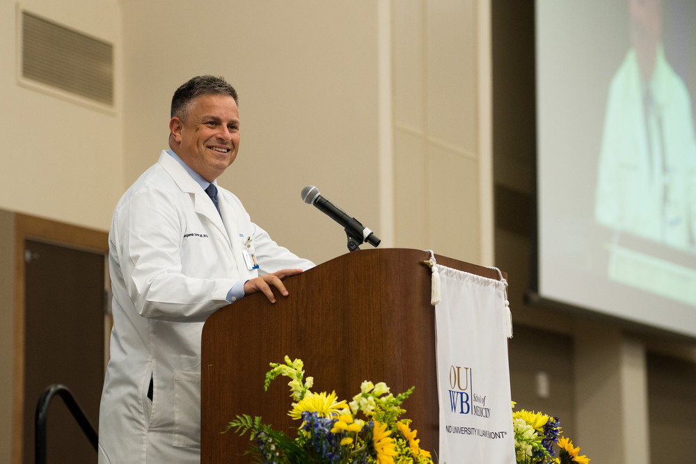 An image of Dr. Schwartz speaking at OUWB's 2022 White Coat Ceremony