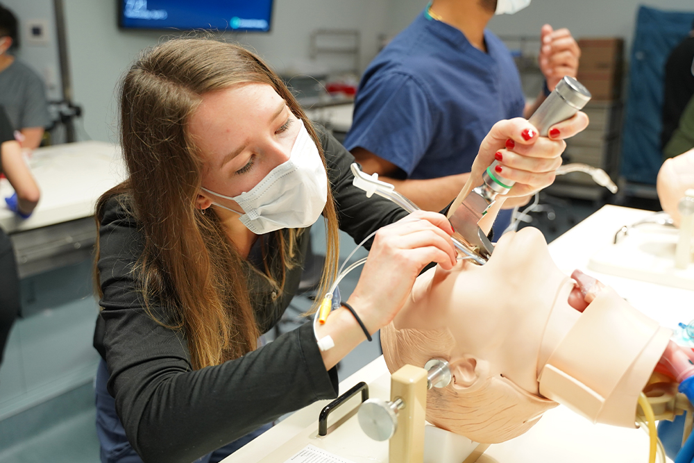 An image of students practicing clinical skills