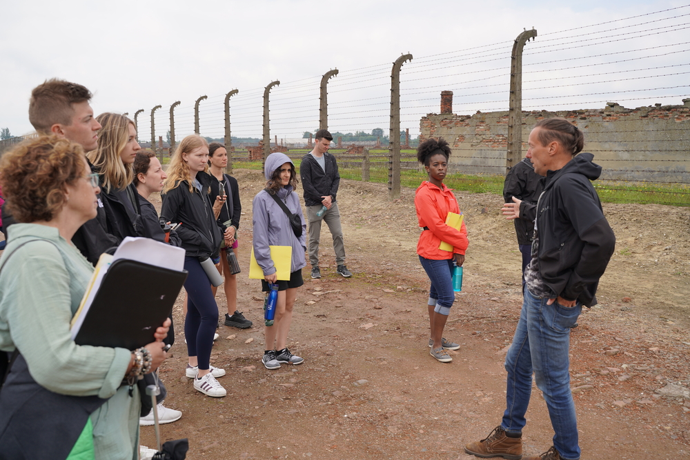 An image of the OUWB cohort at Auschwitz-Birkenau in 2022