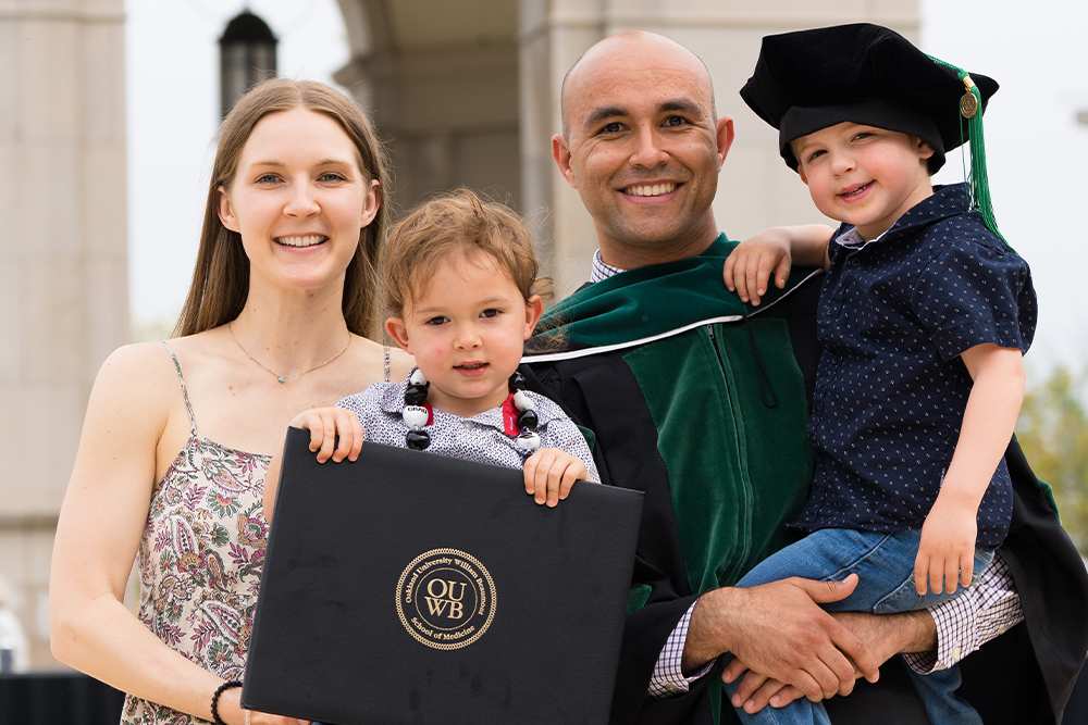 An image of an OUWB graduate and his family