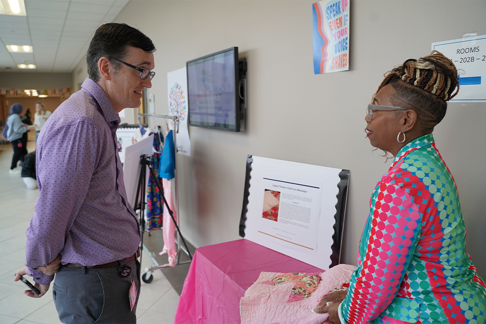 An image of Dr. Jones talking with Dr. Bailey