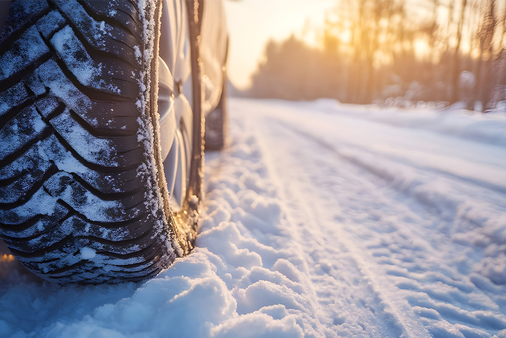 An image of a vehicle tire on snow