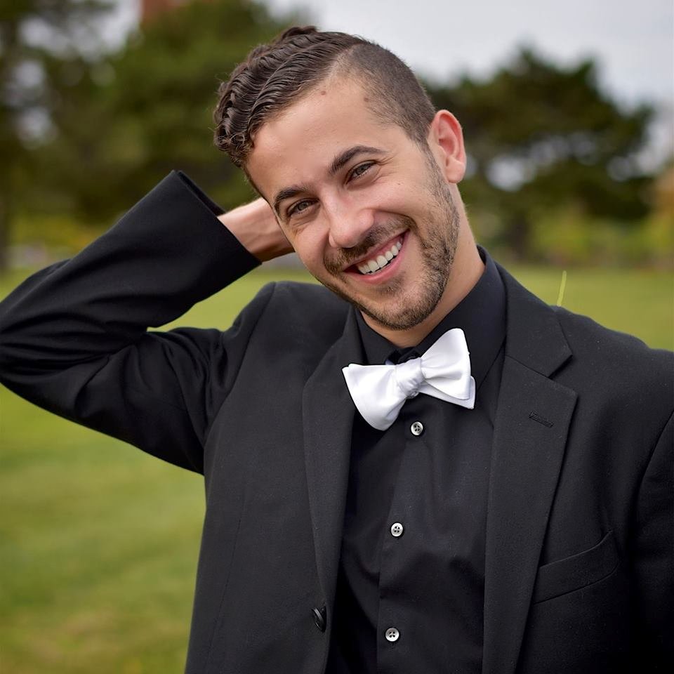 Kayvon smiling in a tuxedo