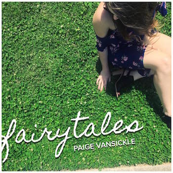 Album cover that says fairytales, paige vansickle, with an image of Paige VanSickle sitting in the grass