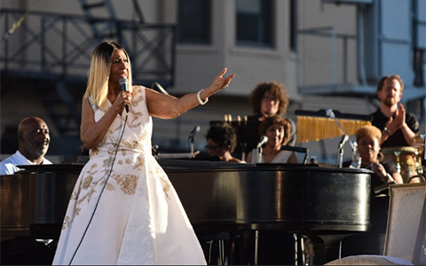 Mark Stone, (back row, far right) plays with Aretha Franklin's band in an outdoor concert