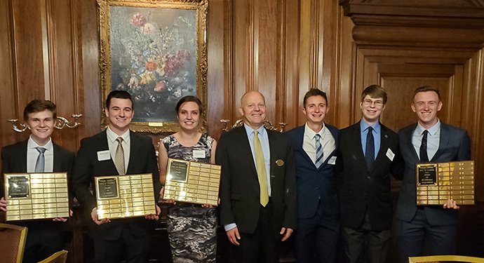 A group of students with awards