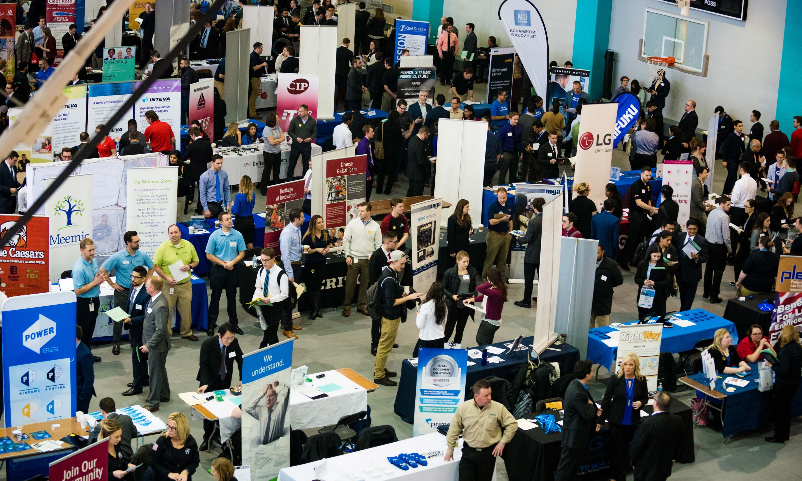 Guests walking around and vendors at tables at the Winter Career Fair hosted by Career Services on Jan. 25, 2017