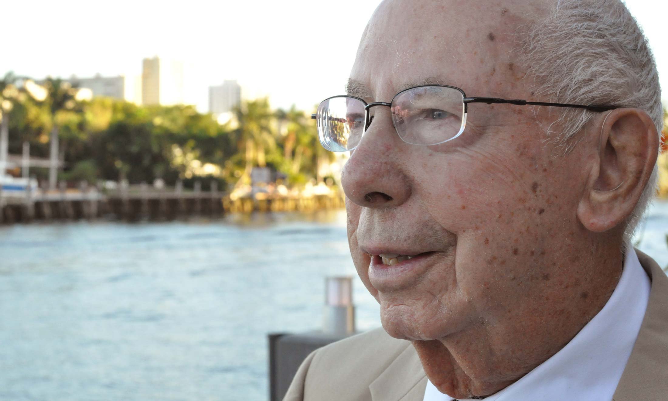 Retired Oakland University Professor Emeritus William Schwab in Fort Lauderdale, Florida. Close up of his face, standing on a dock and looking out into the water