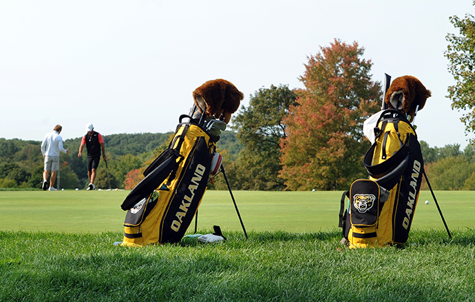 Two Oakland University golf bags.