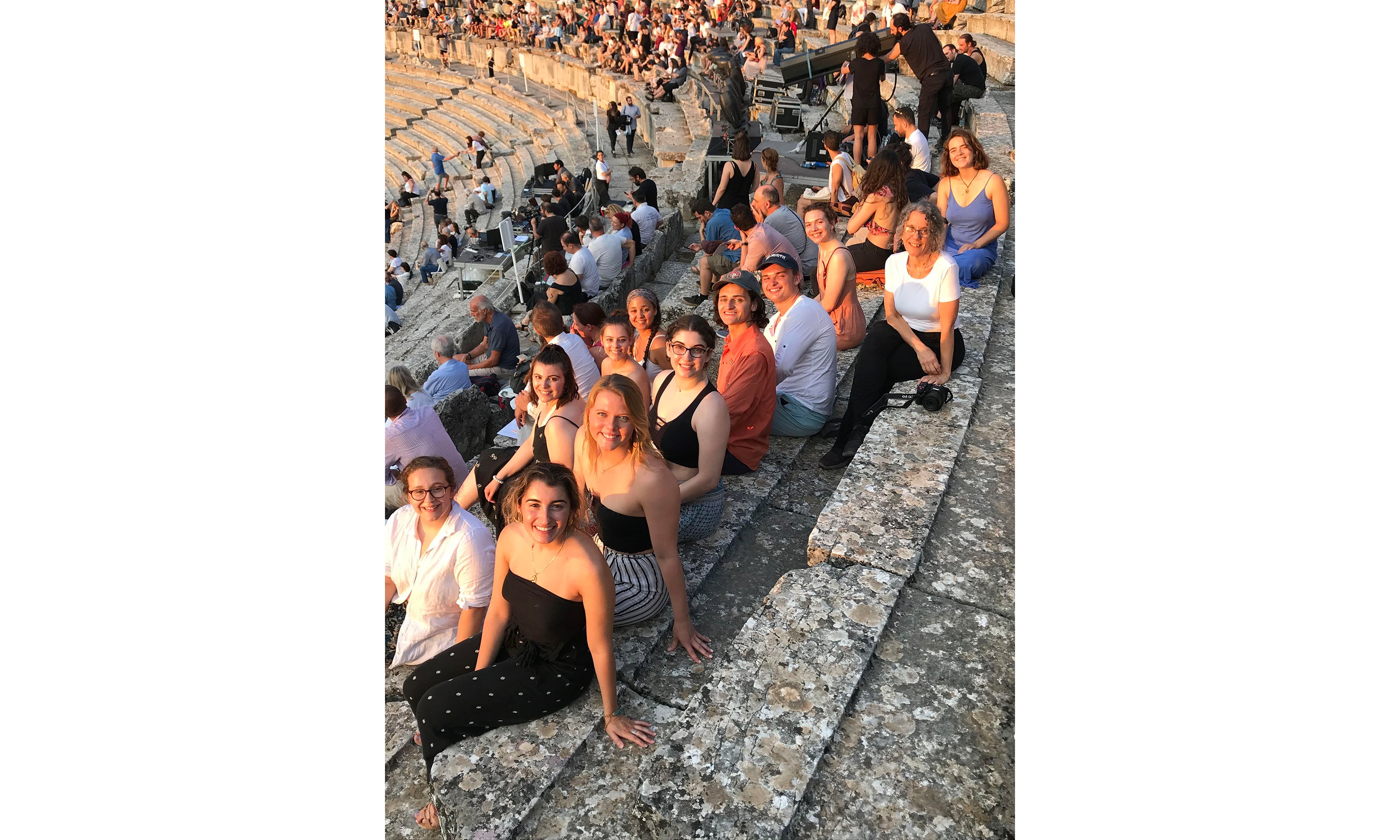 Group of students sitting in Greek stadium