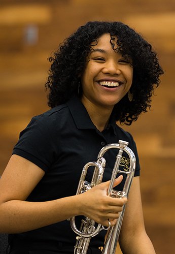 Woman holding trumpet