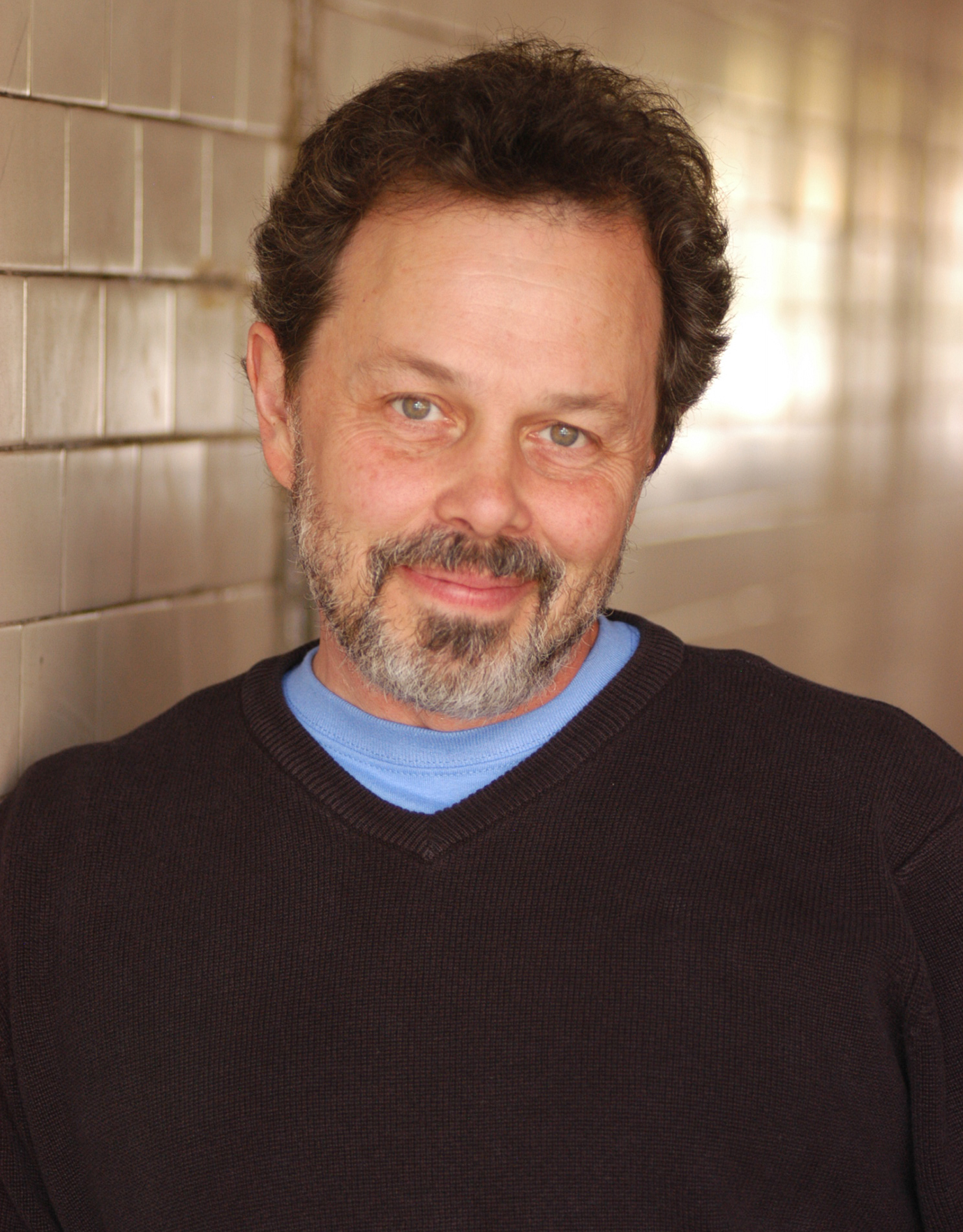 A headshot of Curtis Armstrong
