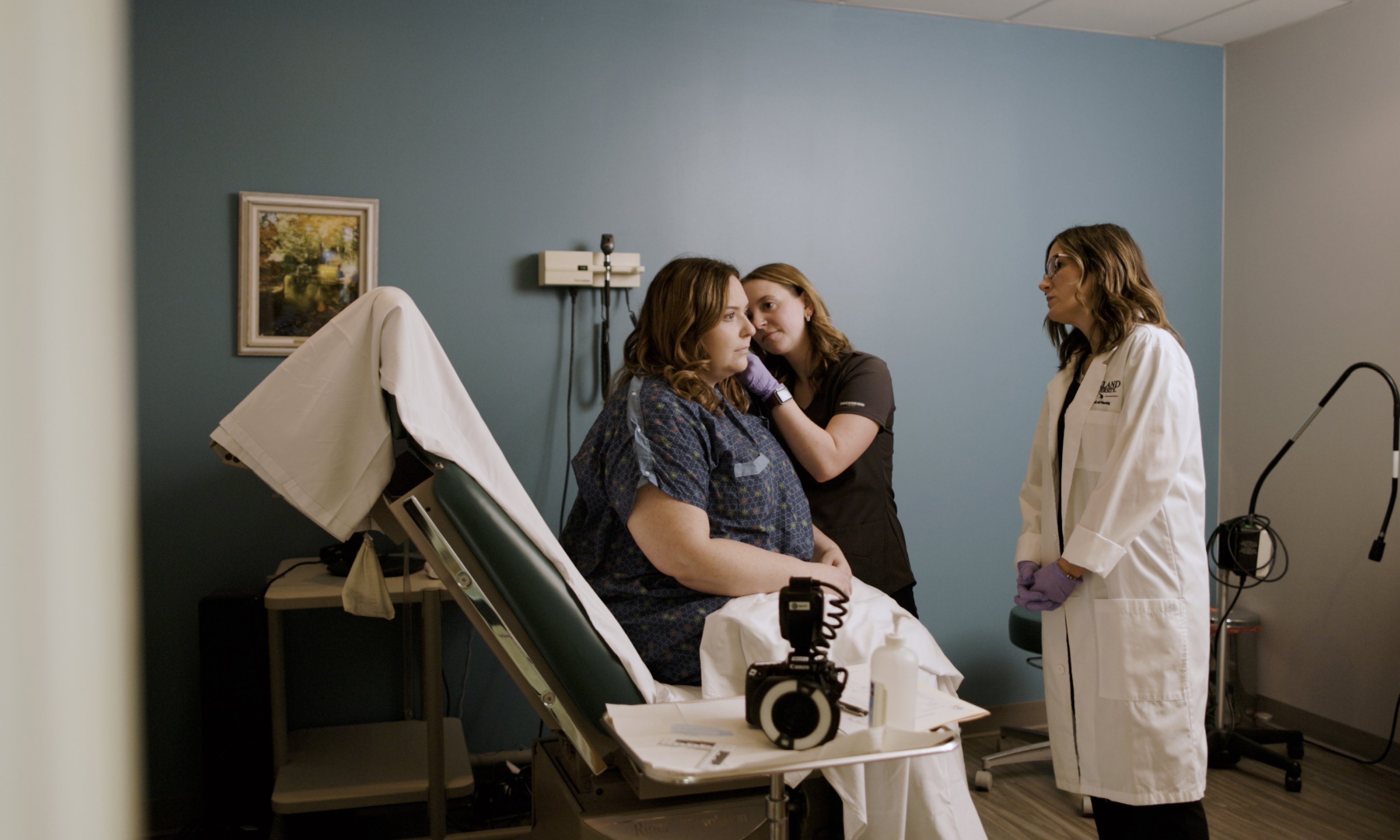 Two nursing working with patient