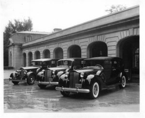 old black and white photo with packard limos