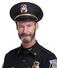 A headshot of Mark B. Gordon in a police uniform.