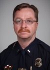 A headshot of Terry Ross in a police uniform.