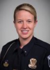 A headshot of Nicole Thompson in a police uniform.