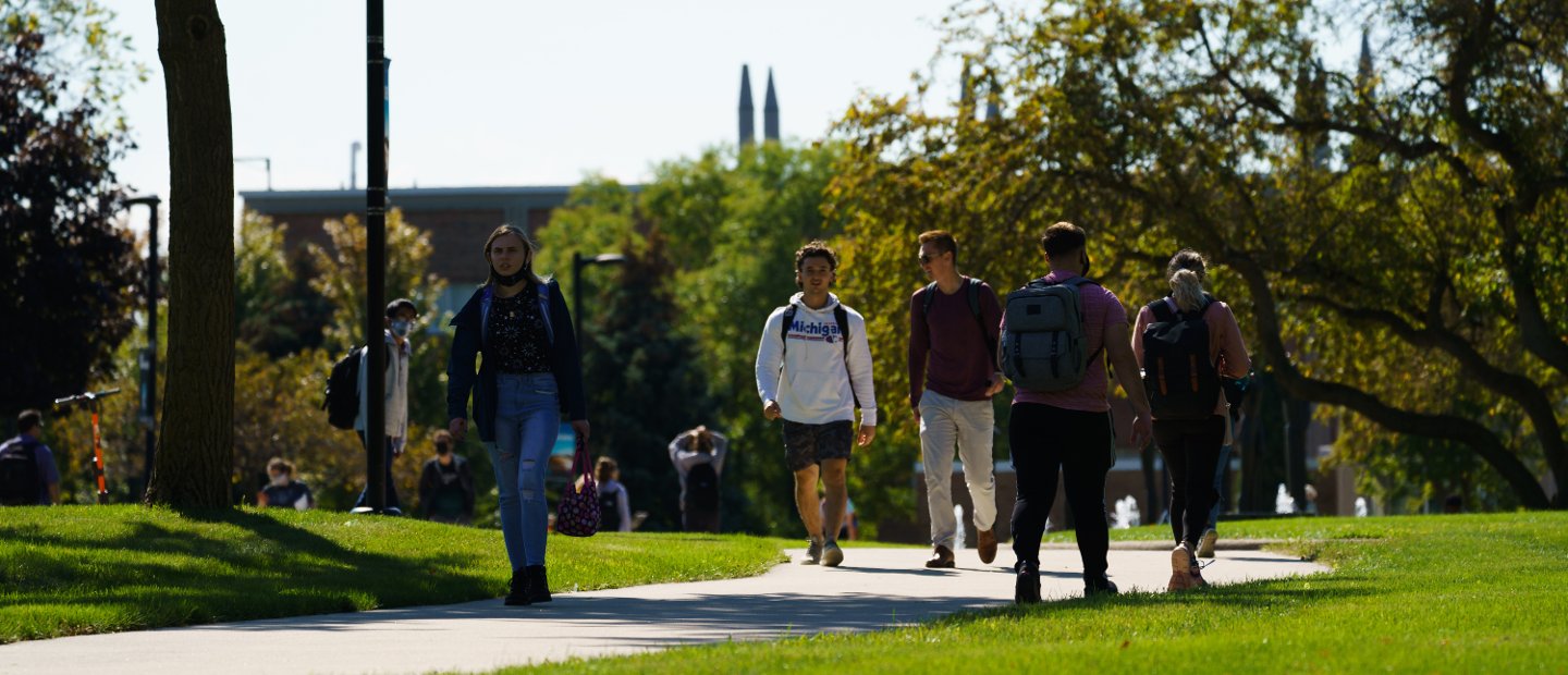 Students walking across campus at Oakland University.