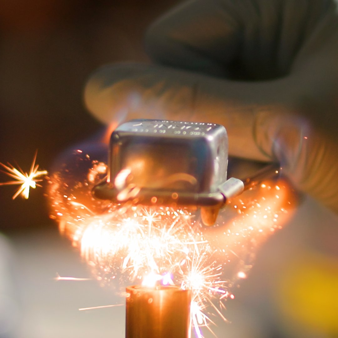 A person welding metal.