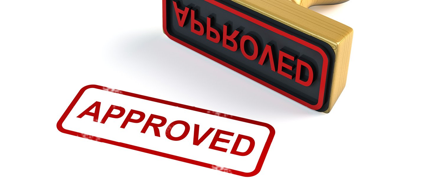 A stamp in red ink on a white background that says "Approved"