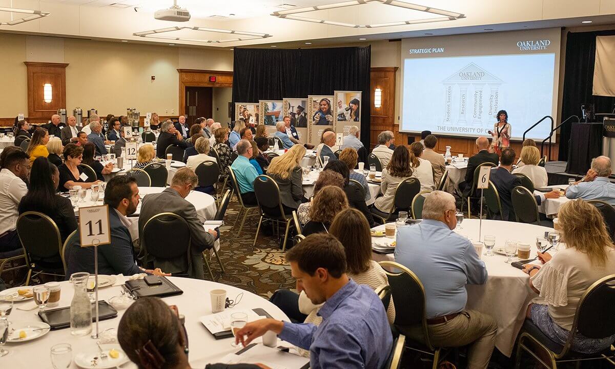 People in a banquet hall for a lecture