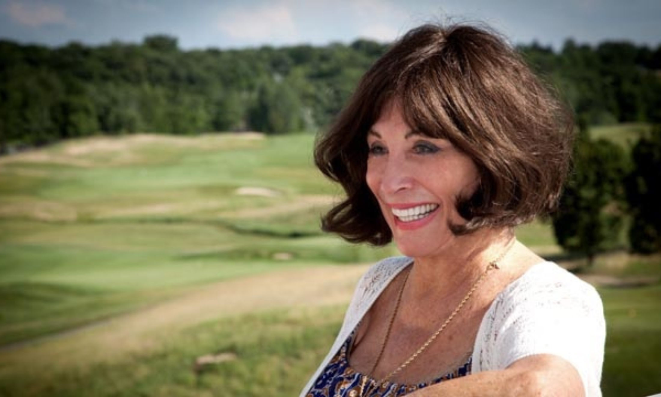 Woman in profile outside on golf course