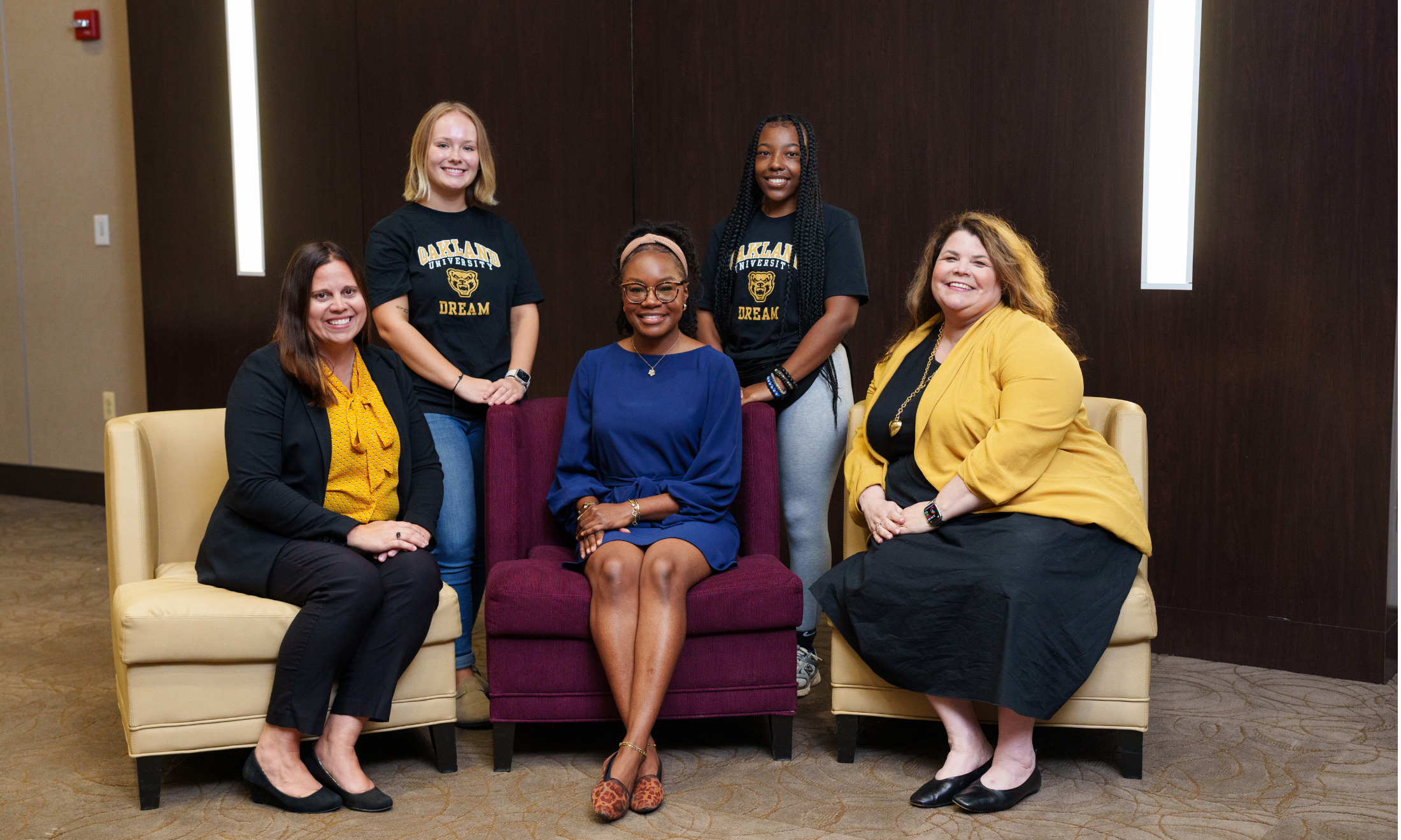 Students and adults seated inside