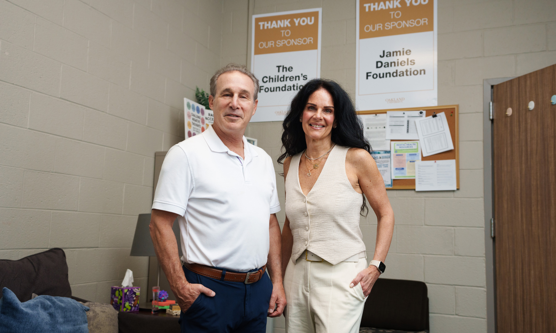 Man and woman standing inside
