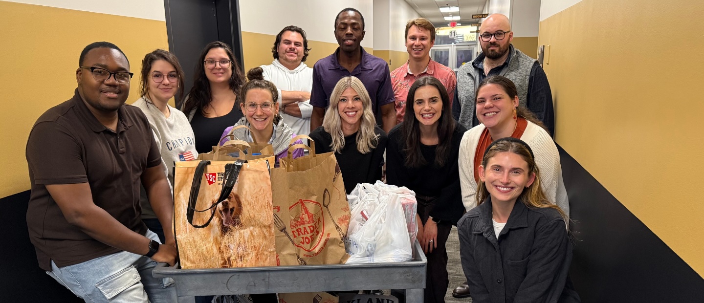 A group photo of young Oakland University alumni