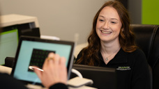 Mary Gallagher seated across from a person on a laptop