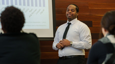 Daviion Burks presenting in front of a group
