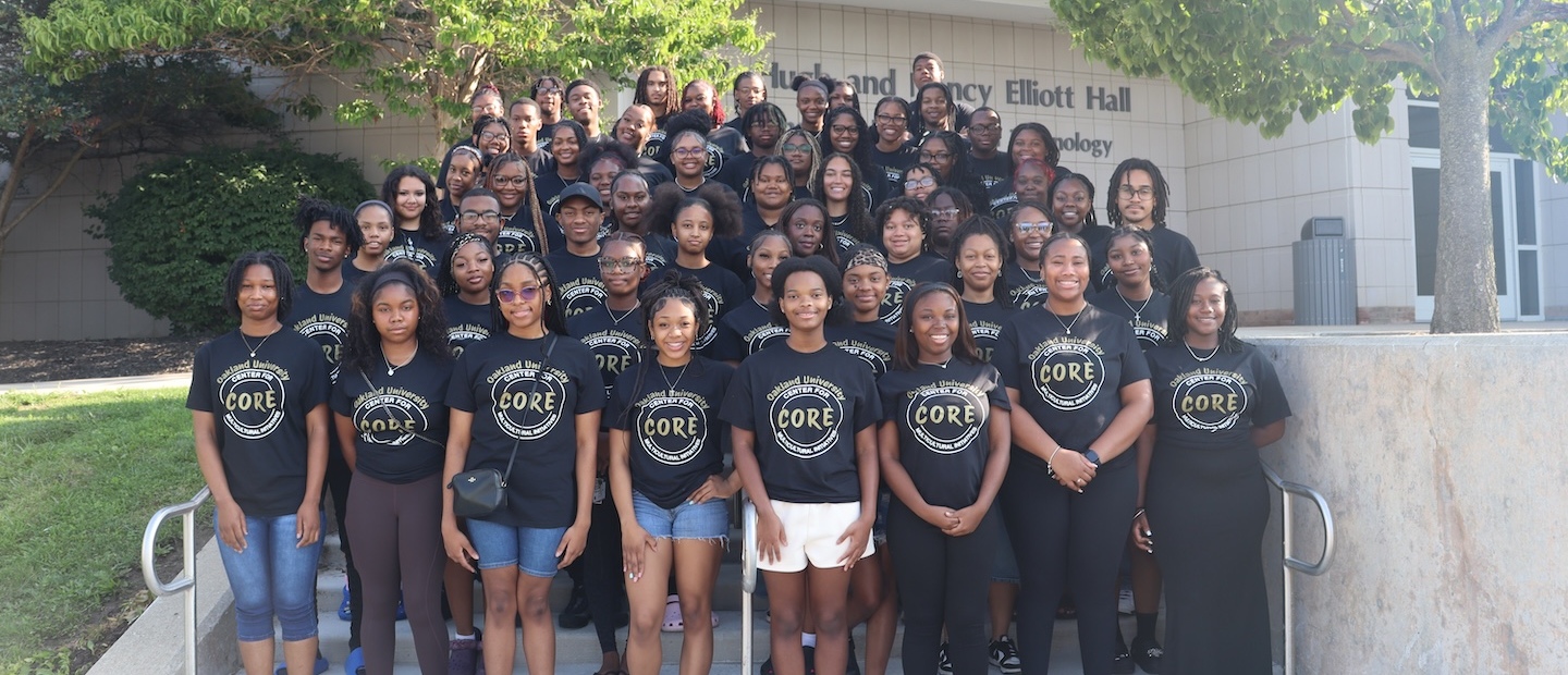 Group of CMI students smiling into camera