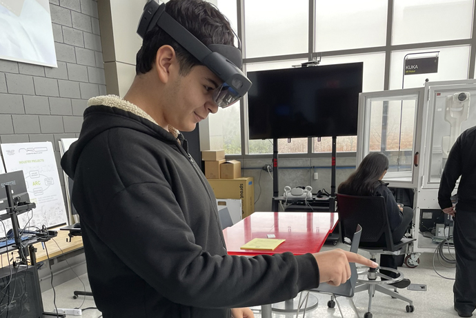 A student from Detroit Public Schools taking part in an exercise within the augmented reality center