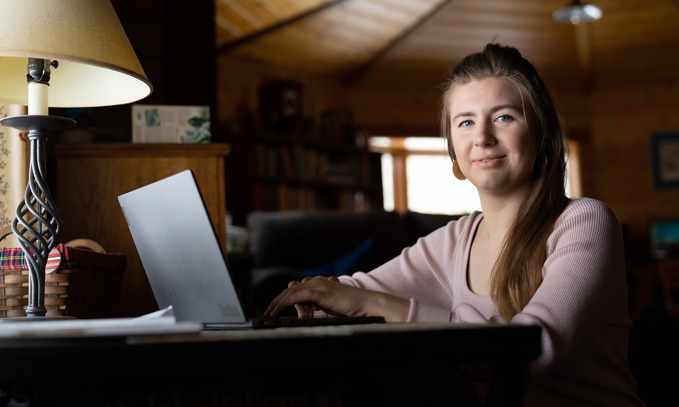 A woman sitting at a computer.