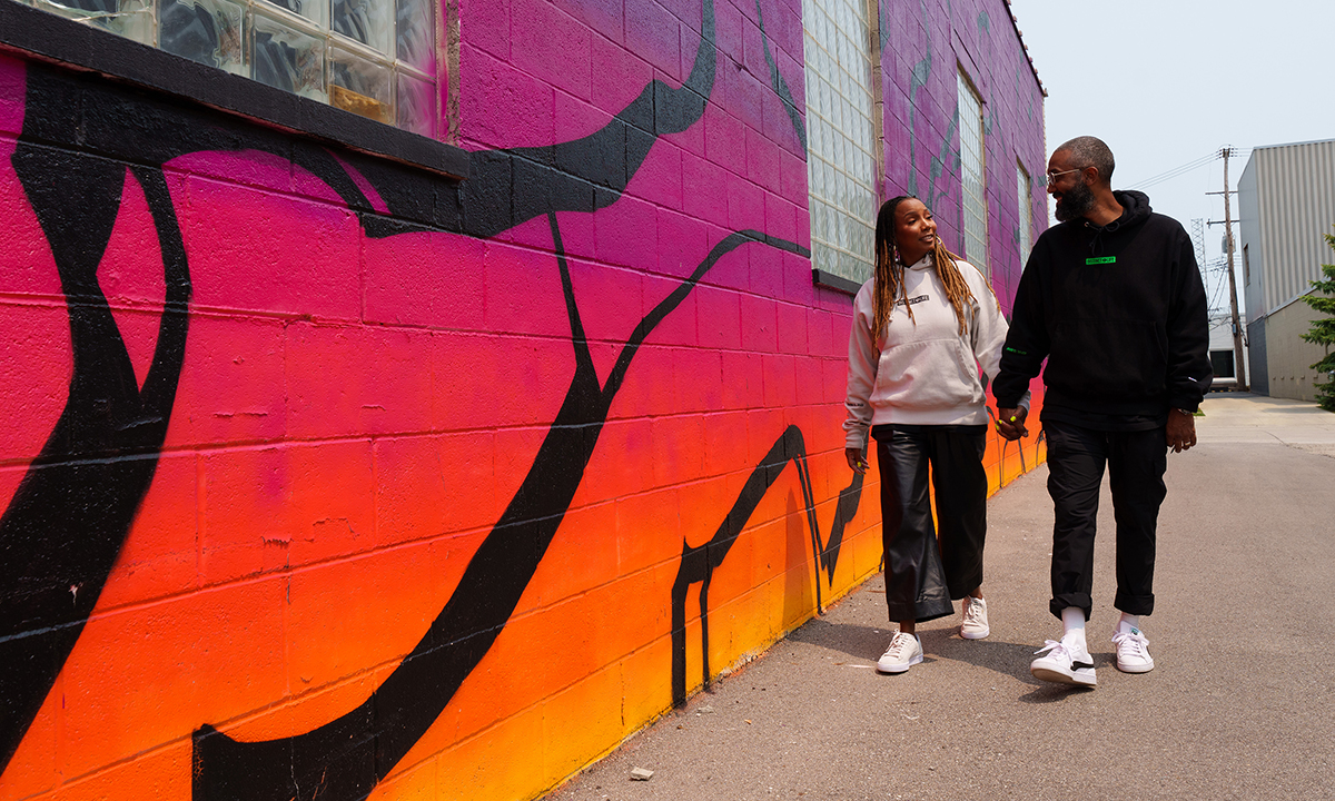 A couple holding hands.